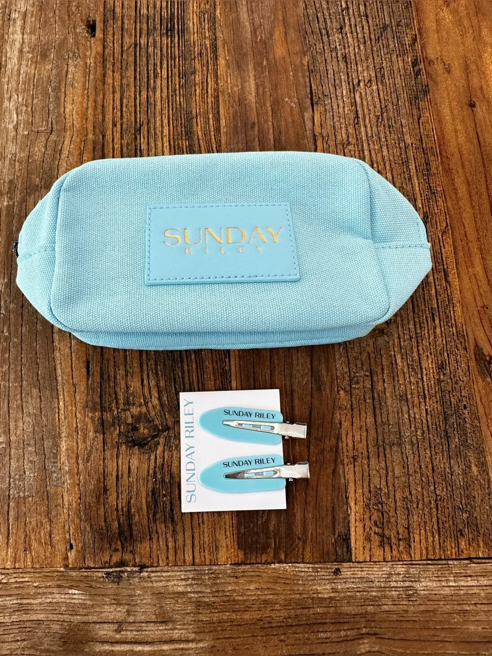Sunday Riley Pastel Blue Canvas Cosmetic Pouch with Gold Logo